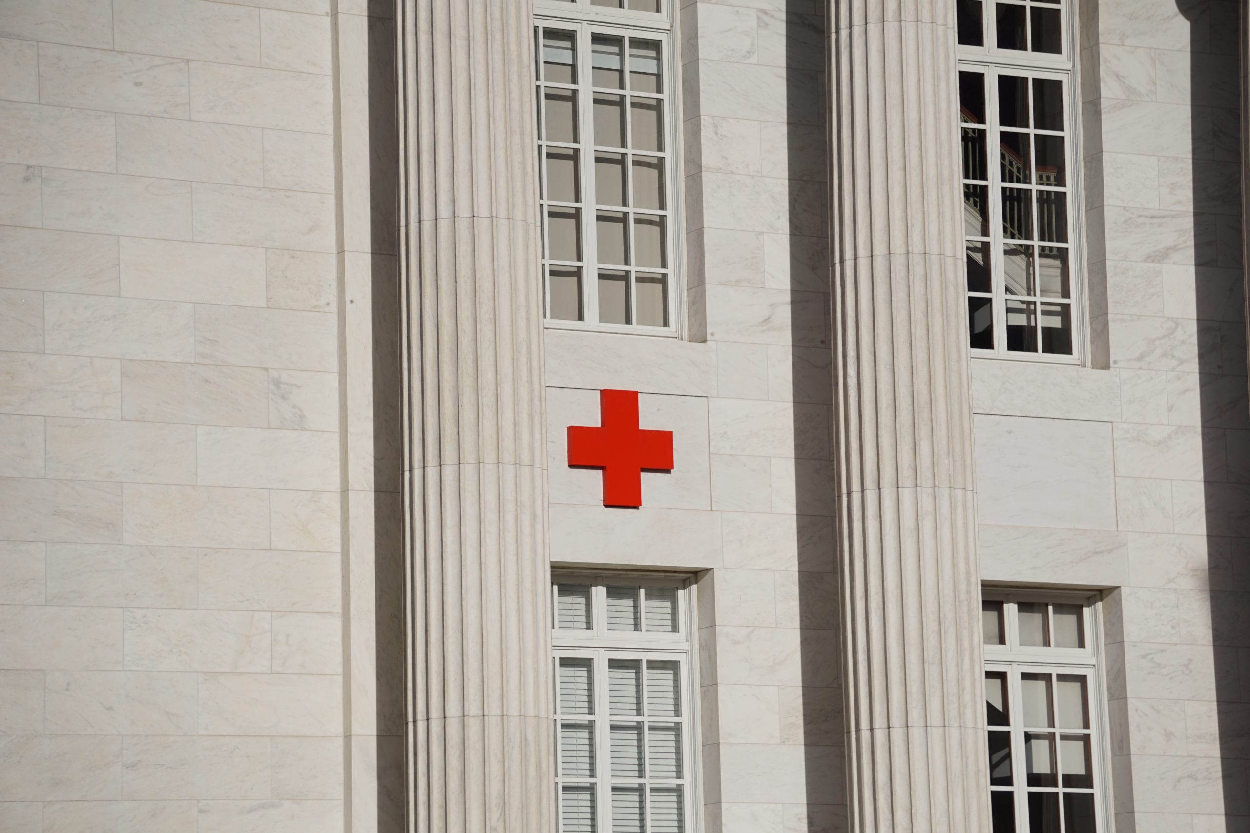 red cross on white concrete building
